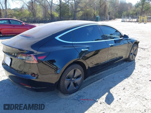 2019 Tesla Model 3 Mid Range with VIN 5YJ3E1EA2KF306286, listed as a IAAI auction lot 41699127 with 56,249 mi miles and . Bid and sale history available at DreamBid. Image 4.