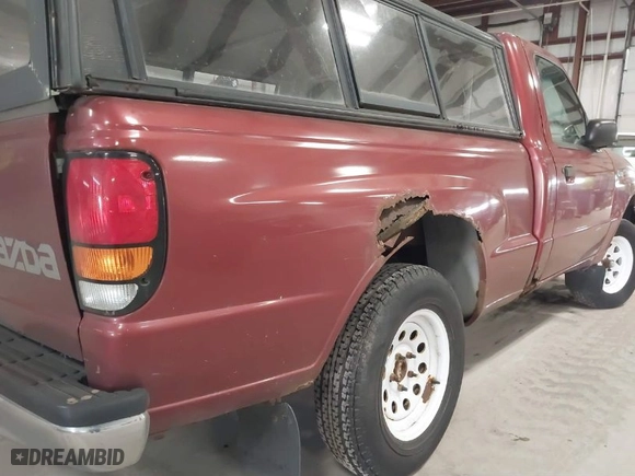 1999 Mazda B-Series 2WD Truck SX with VIN 4F4YR12C8XTM08476, listed as a IAAI auction lot 41864144 with NaN miles. Bid and sale history available at carsss.com. Image 15.