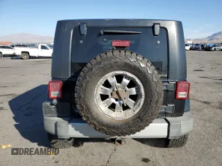 2010 Jeep Wrangler Unlimited Sahara with VIN 1J4BA5H17AL123479, listed as a Copart auction lot 49066315 with 114,419 mi miles and Salvage Title. Bid and sale history available at carsss.com. Image 6.