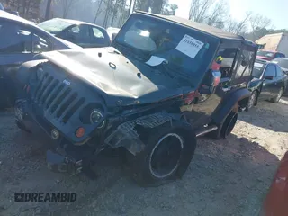 2010 Jeep Wrangler Sport with VIN 1J4AA2D16AL212492, listed as a IAAI auction lot 41656955 with 225,718 mi miles and . Bid and sale history available at carsss.com. Image 2.
