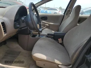 1999 Saturn SL z VIN 1G8ZH5283XZ349797, wystawiony jako Copart lot #58221955 z przebiegiem 148 506 mil mil oraz Nie do naprawy. Historia ofert i sprzedaży dostępna na DreamBid. Obrazek 7.