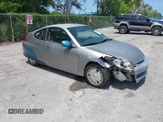 2004 Honda Insight z VIN JHMZE14744T000527, wystawiony jako IAAI lot #42378630 z przebiegiem 1 360 mil mil oraz . Historia ofert i sprzedaży dostępna na DreamBid. Obrazek 1.