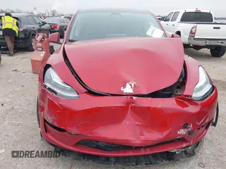 2023 Tesla Model Y Long Range with VIN 7SAYGDEE6PA027497, listed as a IAAI auction lot 41491072 with 24,962 mi miles and . Bid and sale history available at DreamBid. Image 10.