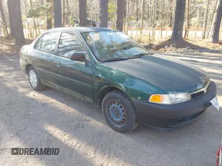 2001 Mitsubishi Mirage ES z VIN JA3AY26C01U042235, wystawiony jako IAAI lot #41899635 z przebiegiem 101 058 mil mil oraz . Historia ofert i sprzedaży dostępna na DreamBid. Obrazek 1.