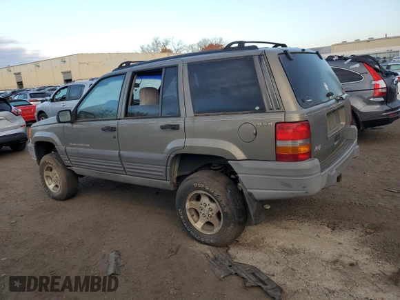 1997 Jeep Grand Cherokee Laredo with VIN 1J4GZ58S1VC741586, listed as a Copart auction lot 77619394 with 0 mi miles and Clean Title. Bid and sale history available at carsss.com. Image 2.