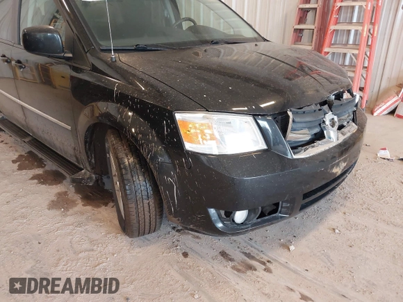 2010 Dodge Grand Caravan Crew with VIN 2D4RN6DX1AR438135, listed as a IAAI auction lot 41734378 with 57,041 mi miles and . Bid and sale history available at DreamBid. Image 13.