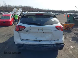 2016 Mazda CX-5 Grand Touring with VIN JM3KE4DYXG0836692, listed as a IAAI auction lot 41812584 with 119,302 mi miles. Bid and sale history available at carsss.com. Image 16.