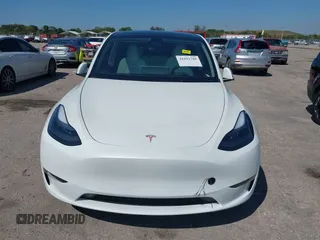 2024 Tesla Model Y with VIN 7SAYGDED9RF161420, listed as a IAAI auction lot 41892788 with 12,353 mi miles and . Bid and sale history available at DreamBid. Image 12.