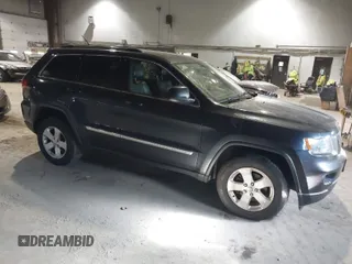 2013 Jeep Grand Cherokee Laredo with VIN 1C4RJFAG9DC583269, listed as a IAAI auction lot 41241085 with 147,995 mi miles. Bid and sale history available at carsss.com. Image 1.
