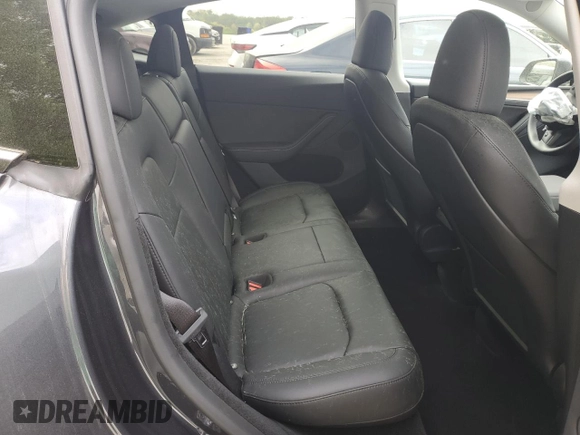 2024 Tesla Model Y Long Range z VIN 7SAYGDEE9RA293776, wystawiony jako Copart lot #51289225 z przebiegiem 12 990 mil mil oraz Szkoda całkowita • Salvage title. Historia ofert i sprzedaży dostępna na DreamBid. Obrazek 10.