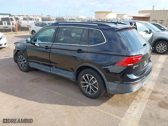 2019 Volkswagen Tiguan SE with VIN 3VV3B7AXXKM012766, listed as a IAAI auction lot 41571347 with 56,594 mi miles. Bid and sale history available at carsss.com. Image 3.