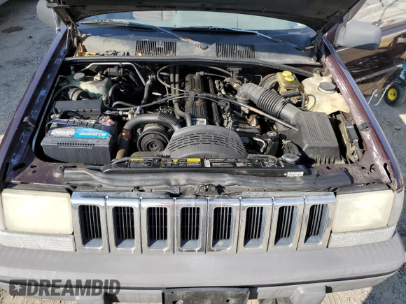 1993 Jeep Grand Cherokee Laredo with VIN 1J4GZ58S8PC656490, listed as a Copart auction lot 49377485 with 236,215 mi miles and Salvage Title. Bid and sale history available at carsss.com. Image 12.