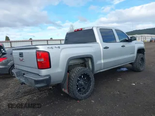 2014 GMC Sierra 1500 with VIN 3GTU2TEH8EG223028, listed as a IAAI auction lot 41858801 with 173,825 mi miles. Bid and sale history available at carsss.com. Image 4.