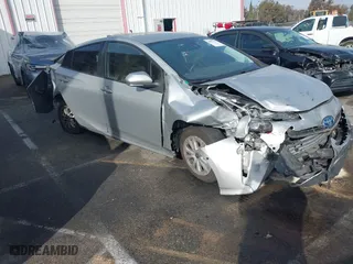2021 Toyota Prius L Eco with VIN JTDKAMFU8M3135514, listed as a IAAI auction lot 40977114 with 70,451 mi miles. Bid and sale history available at carsss.com. Image 1.