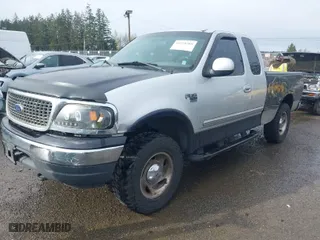 2000 Ford F-150 XL with VIN 1FTRX18L8YKA72409, listed as a IAAI auction lot 41928360 with 167,251 mi miles. Bid and sale history available at carsss.com. Image 2.