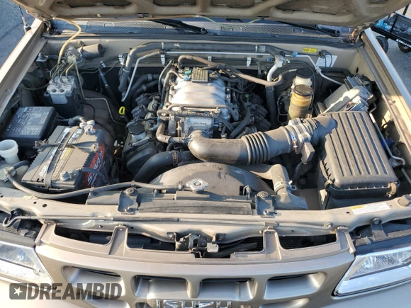 2001 Isuzu Rodeo S with VIN 4S2CK58W314334096, listed as a Copart auction lot 68262924 with 140,657 mi miles and Salvage Title. Bid and sale history available at DreamBid. Image 12.