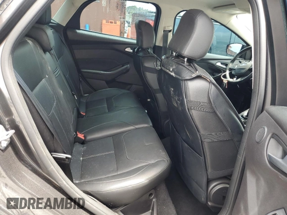 2015 Ford Focus Titanium z VIN 1FADP3N28FL239706, wystawiony jako Copart lot #62478895 z przebiegiem 143 536 mil mil oraz Szkoda całkowita • Salvage title. Historia ofert i sprzedaży dostępna na DreamBid. Obrazek 10.