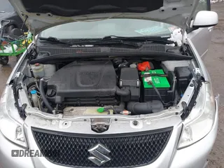 2011 Suzuki SX4 with VIN JS2YC5A41B6300385, listed as a IAAI auction lot 41570810 with 117,847 mi miles and . Bid and sale history available at DreamBid. Image 10.