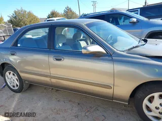 1999 Mazda 626 LX with VIN 1YVGF22D8X5871485, listed as a IAAI auction lot 41641049 with 115,603 mi miles. Bid and sale history available at carsss.com. Image 13.