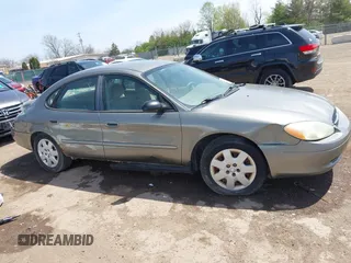 2003 Ford Taurus LX Standard with VIN 1FAFP52U63A235154, listed as a IAAI auction lot 42084426 with 162,497 mi miles and . Bid and sale history available at DreamBid. Image 12.