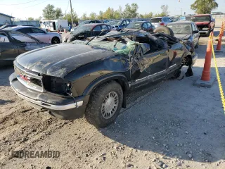 1995 GMC Jimmy SL with VIN 1GKDT13W4S2547931, listed as a Copart auction lot 74549694 with 99,373 mi miles and Salvage Title. Bid and sale history available at carsss.com. Image 1.