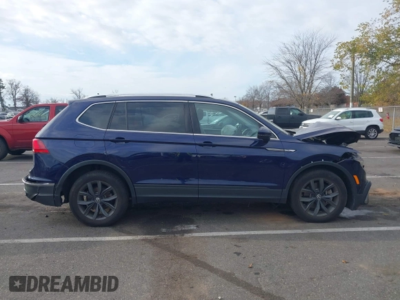 2023 Volkswagen Tiguan SE z VIN 3VVMB7AX3PM006867, wystawiony jako IAAI lot #40793976 z przebiegiem 29 648 mil mil oraz . Historia ofert i sprzedaży dostępna na DreamBid. Obrazek 13.