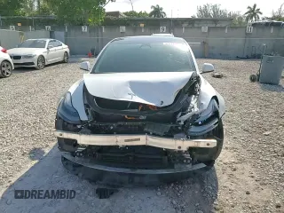 2023 Tesla Model 3 with VIN 5YJ3E1EA6PF510323, listed as a Copart auction lot 52094495 with 115,928 mi miles and Salvage Title. Bid and sale history available at DreamBid. Image 14.