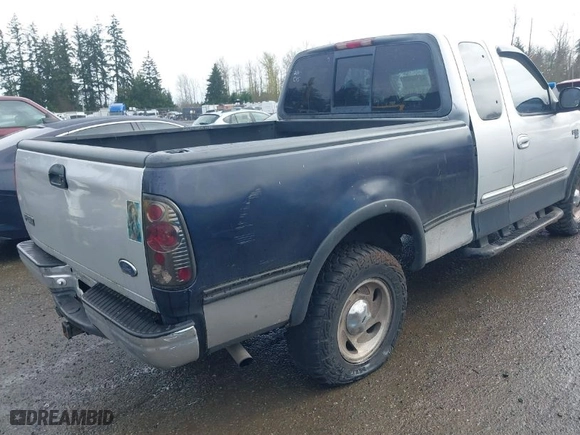 2000 Ford F-150 XL with VIN 1FTRX18L8YKA72409, listed as a IAAI auction lot 41928360 with 167,251 mi miles. Bid and sale history available at carsss.com. Image 4.