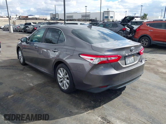 2020 Toyota Camry LE with VIN 4T1C11AK3LU363417, listed as a IAAI auction lot 41430382 with 130,837 mi miles. Bid and sale history available at carsss.com. Image 3.