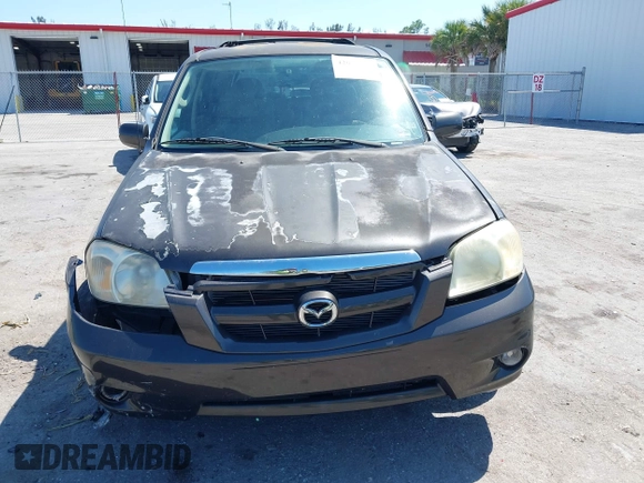 2006 Mazda Tribute i with VIN 4F2YZ02Z36KM29148, listed as a IAAI auction lot 42044163 with 175,786 mi miles and . Bid and sale history available at carsss.com. Image 6.