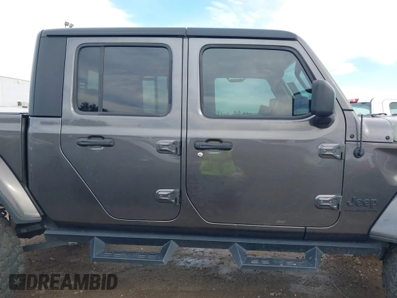 2023 Jeep Gladiator Sport S z VIN 1C6HJTAG9PL554845, wystawiony jako IAAI lot #41312360 z przebiegiem 18 077 mil mil oraz . Historia ofert i sprzedaży dostępna na DreamBid. Obrazek 14.