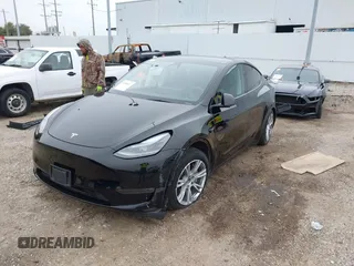 2023 Tesla Model Y Long Range z VIN 7SAYGDEEXPA181114, wystawiony jako IAAI lot #41564617 z przebiegiem 64 990 mil mil oraz . Historia ofert i sprzedaży dostępna na DreamBid. Obrazek 2.