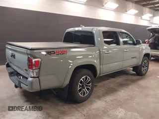 2023 Toyota Tacoma 4WD SR with VIN 3TMCZ5ANXPM607489, listed as a IAAI auction lot 41605018 with 15,229 mi miles. Bid and sale history available at carsss.com. Image 4.