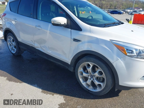 2013 Ford Escape Titanium with VIN 1FMCU0J96DUA71857, listed as a IAAI auction lot 41877003 with 118,864 mi miles and . Bid and sale history available at carsss.com. Image 17.