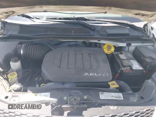 2014 Dodge Grand Caravan American Value with VIN 2C4RDGBG5ER187005, listed as a IAAI auction lot 42018333 with 216,149 mi miles and . Bid and sale history available at DreamBid. Image 10.