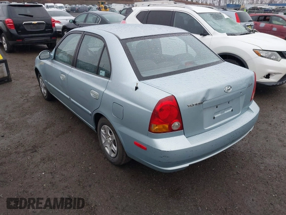 2003 Hyundai Accent GL with VIN KMHCG45C33U473080, listed as a IAAI auction lot 41868765 with 57,478 mi miles. Bid and sale history available at carsss.com. Image 3.