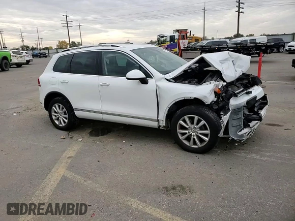 2014 Volkswagen Touareg Sport with VIN WVGEF9BP3ED005921, listed as a Copart auction lot 77372514 with 156,753 mi miles and Salvage Title. Bid and sale history available at DreamBid. Image 12.