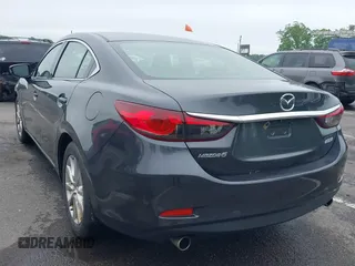 2014 Mazda 6 i Sport with VIN JM1GJ1U52E1102800, listed as a IAAI auction lot 42266283 with 103,886 mi miles and . Bid and sale history available at DreamBid. Image 3.