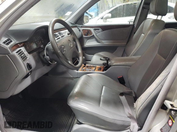 2000 Mercedes-Benz E-Class with VIN WDBJF82J1YX030388, listed as a Copart auction lot 86384974 with 212,596 mi miles and Salvage Title. Bid and sale history available at carsss.com. Image 7.
