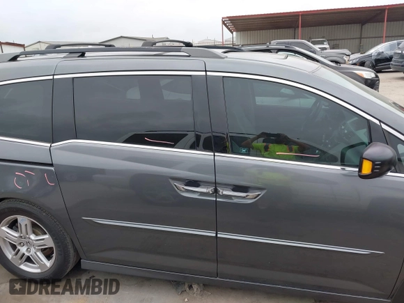 2012 Honda Odyssey Touring with VIN 5FNRL5H96CB138548, listed as a IAAI auction lot 41471856 with 186,284 mi miles and . Bid and sale history available at DreamBid. Image 14.