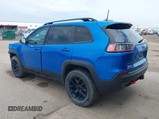 2022 Jeep Cherokee Trailhawk z VIN 1C4PJMBX4ND513488, wystawiony jako IAAI lot #42137114 z przebiegiem 12 306 mil mil oraz . Historia ofert i sprzedaży dostępna na DreamBid. Obrazek 3.