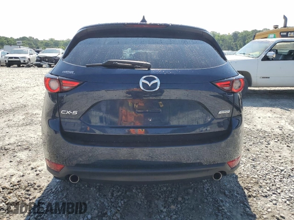 2018 Mazda CX-5 Grand Touring z VIN JM3KFADM5J1420690, wystawiony jako Copart lot #56897875 z przebiegiem 46 483 mil mil oraz Szkoda całkowita • Salvage title. Historia ofert i sprzedaży dostępna na DreamBid. Obrazek 6.