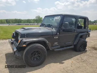 2005 Jeep Wrangler X z VIN 1J4FA39S75P321328, wystawiony jako Copart lot #59711505 z przebiegiem 126 768 mil mil oraz Szkoda całkowita • Salvage title. Historia ofert i sprzedaży dostępna na DreamBid. Obrazek 1.
