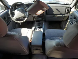 1998 Jeep Cherokee Sport with VIN 1J4FT68S4WL121559, listed as a Copart auction lot 77387794 with 163,453 mi miles and Salvage Title. Bid and sale history available at carsss.com. Image 8.