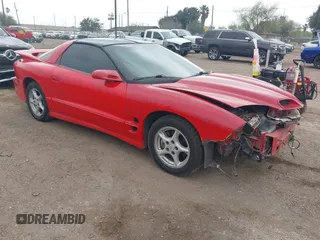 1999 Pontiac Firebird Formula z VIN 2G2FV22G3X2201857, wystawiony jako IAAI lot #41706451 z przebiegiem 73 953 mil mil oraz . Historia ofert i sprzedaży dostępna na DreamBid. Obrazek 1.