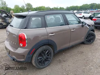 2014 MINI Countryman S with VIN WMWZC5C55EWP41717, listed as a IAAI auction lot 42324347 with Not provided miles and . Bid and sale history available at DreamBid. Image 4.