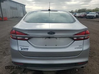 2017 Ford Fusion Hybrid SE z VIN 3FA6P0LU4HR384645, wystawiony jako Copart lot #56454995 z przebiegiem 165 322 mil mil oraz Czysty tytuł • Clean title. Historia ofert i sprzedaży dostępna na DreamBid. Obrazek 6.