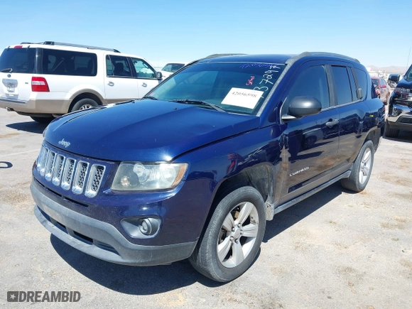 2014 Jeep Compass Sport with VIN 1C4NJCBB2ED737297, listed as a IAAI auction lot 42056598 with 185,155 mi miles. Bid and sale history available at carsss.com. Image 2.