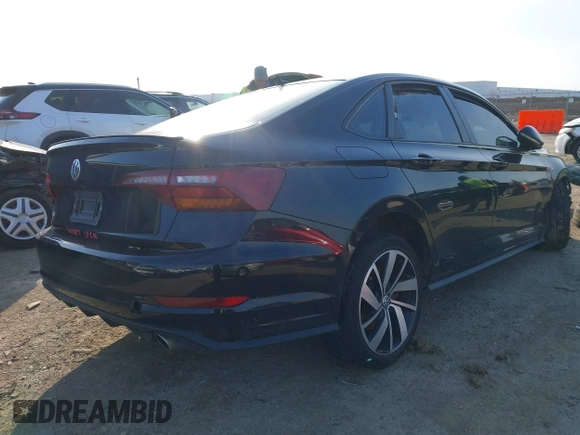2019 Volkswagen Jetta GLI S z VIN 3VW5T7BU3KM245927, wystawiony jako IAAI lot #41573257 z przebiegiem 57 322 mil mil oraz . Historia ofert i sprzedaży dostępna na DreamBid. Obrazek 4.