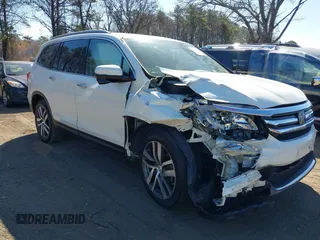2017 Honda Pilot Touring z VIN 5FNYF6H99HB089121, wystawiony jako IAAI lot #41896878 z przebiegiem 145 330 mil mil oraz . Historia ofert i sprzedaży dostępna na DreamBid. Obrazek 1.